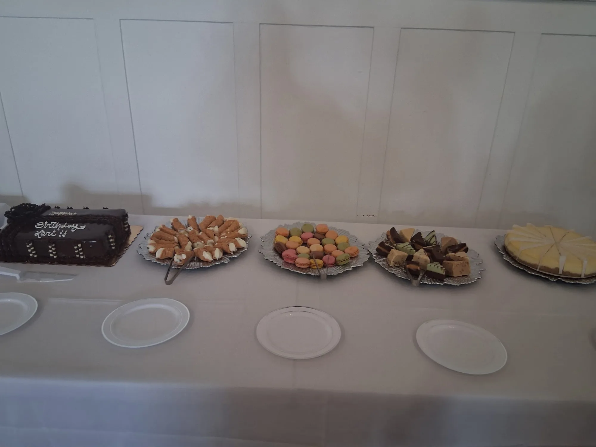 Small appetizer platters arranged on a white catering table in South Florida