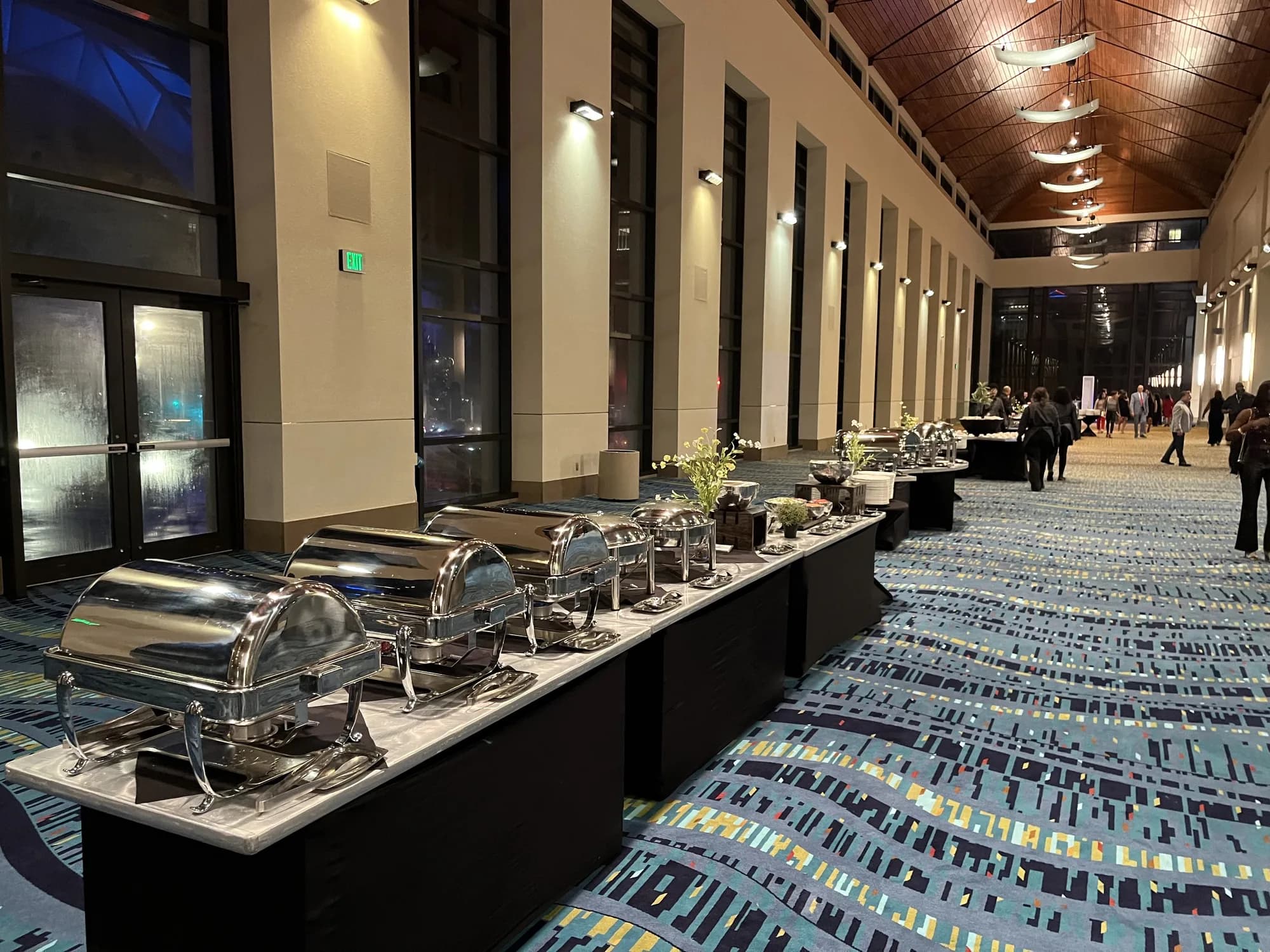 Long buffet line in a hotel ballroom for a gala