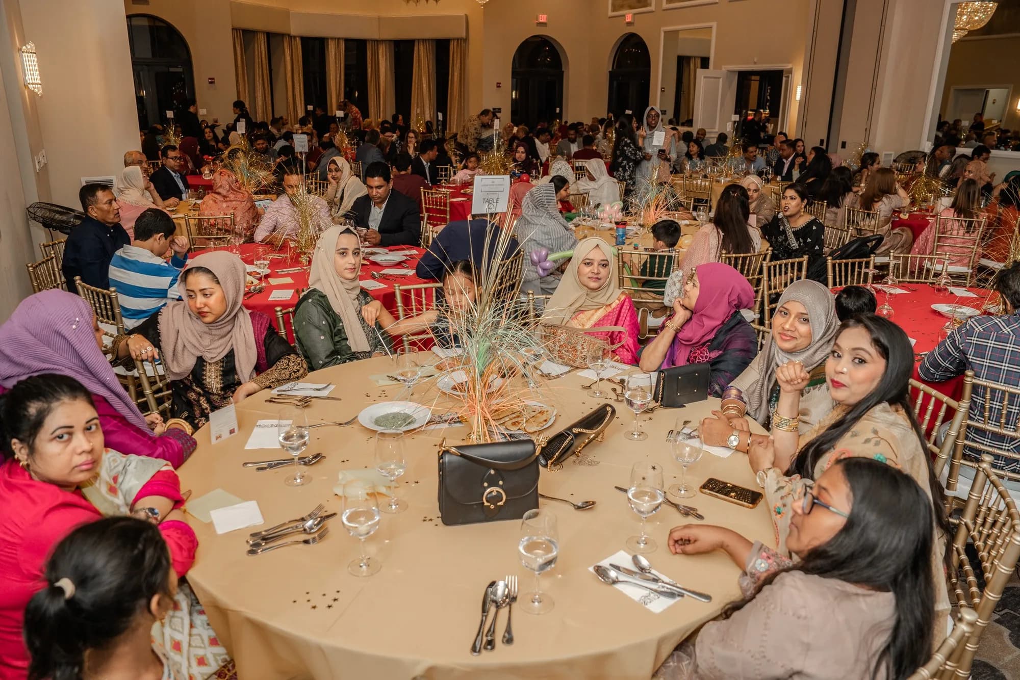 Guests at round tables during a birthday dinner