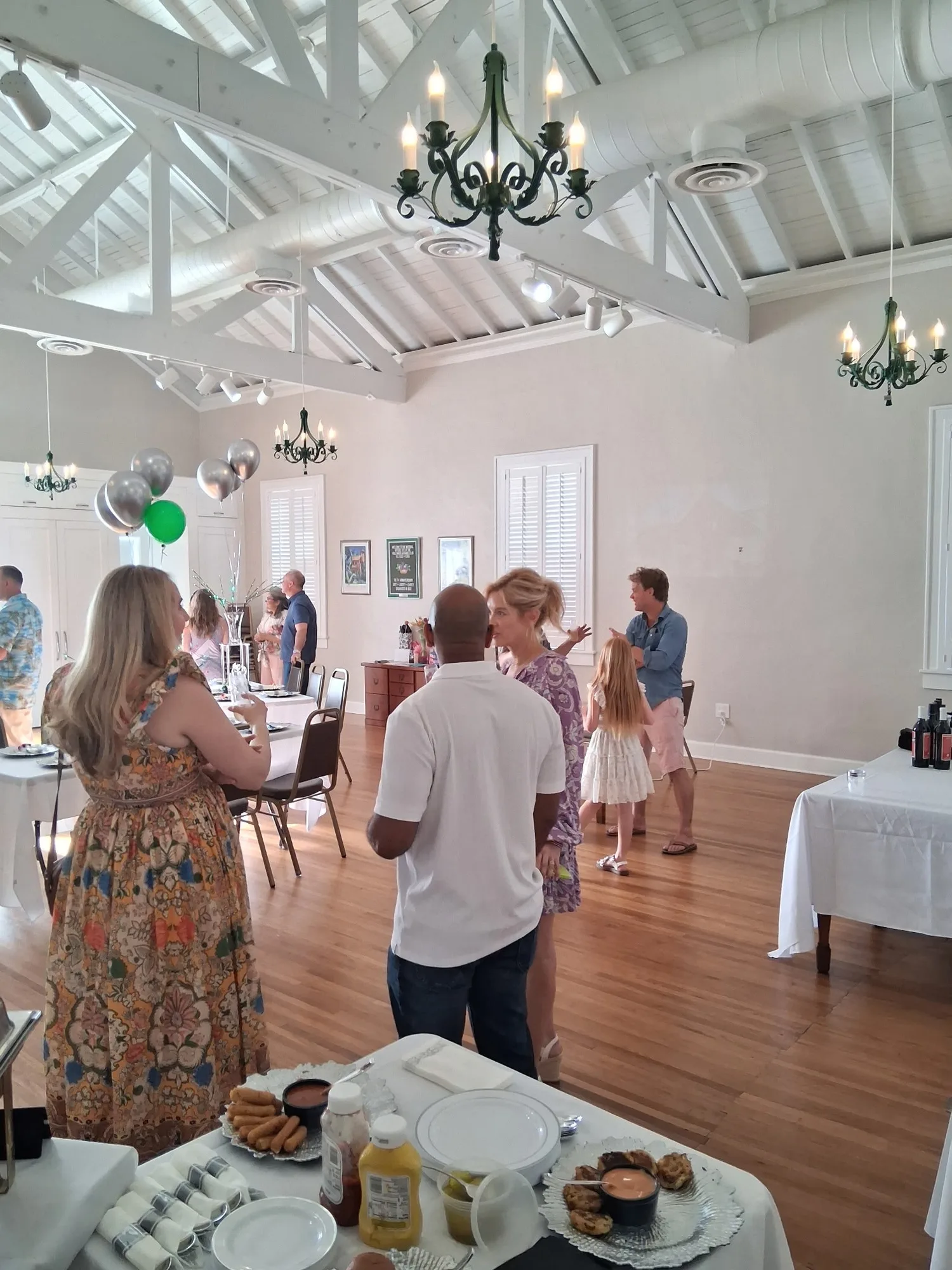 Birthday party in a hall with balloons and a buffet