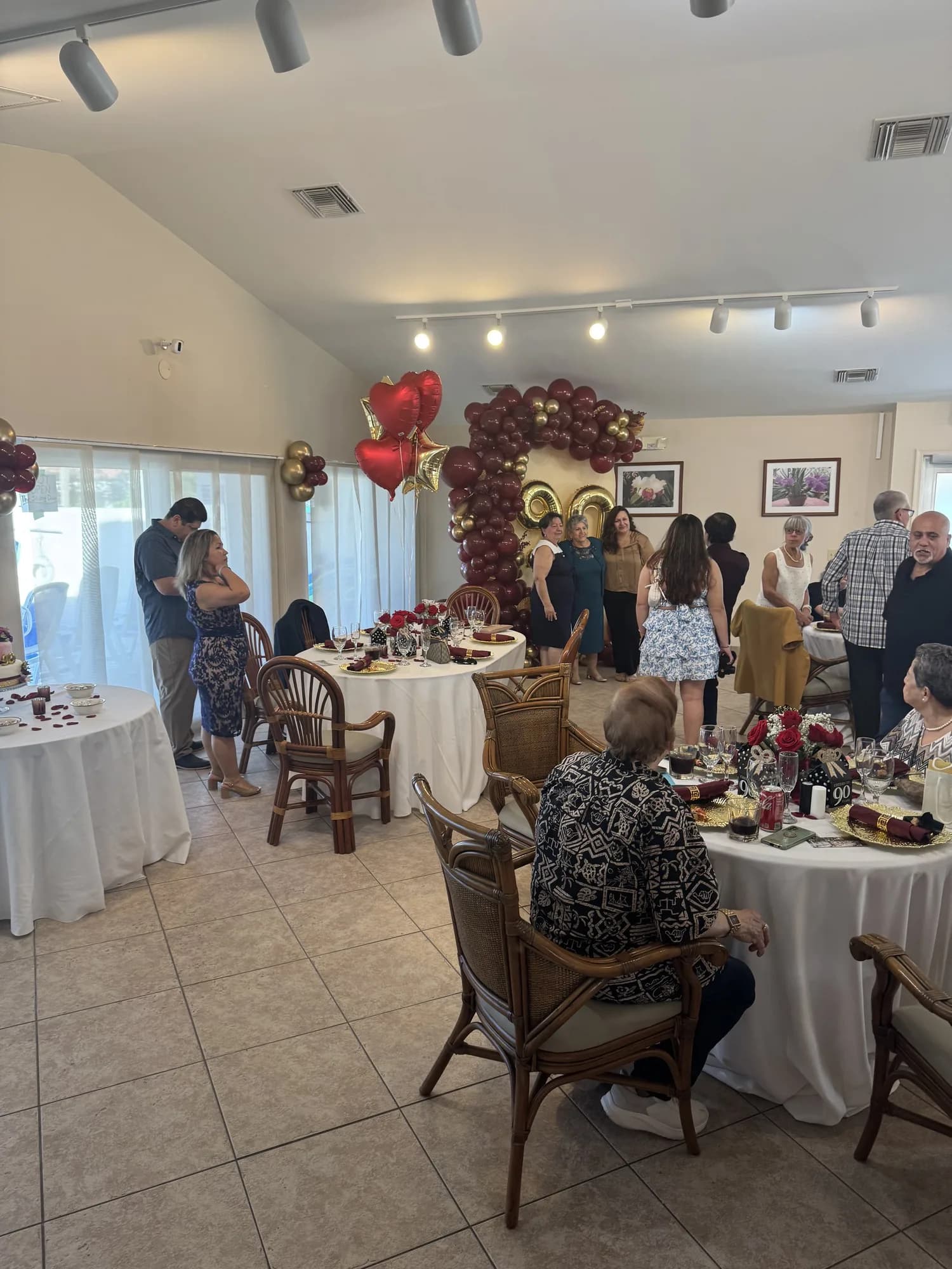 Birthday luncheon with a floral balloon arch