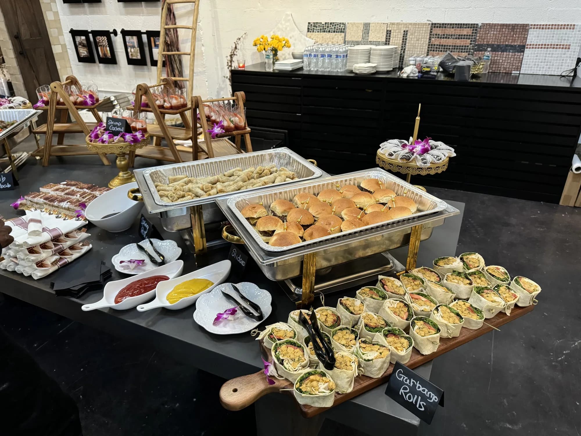 Catered buffet spread accented with orchids