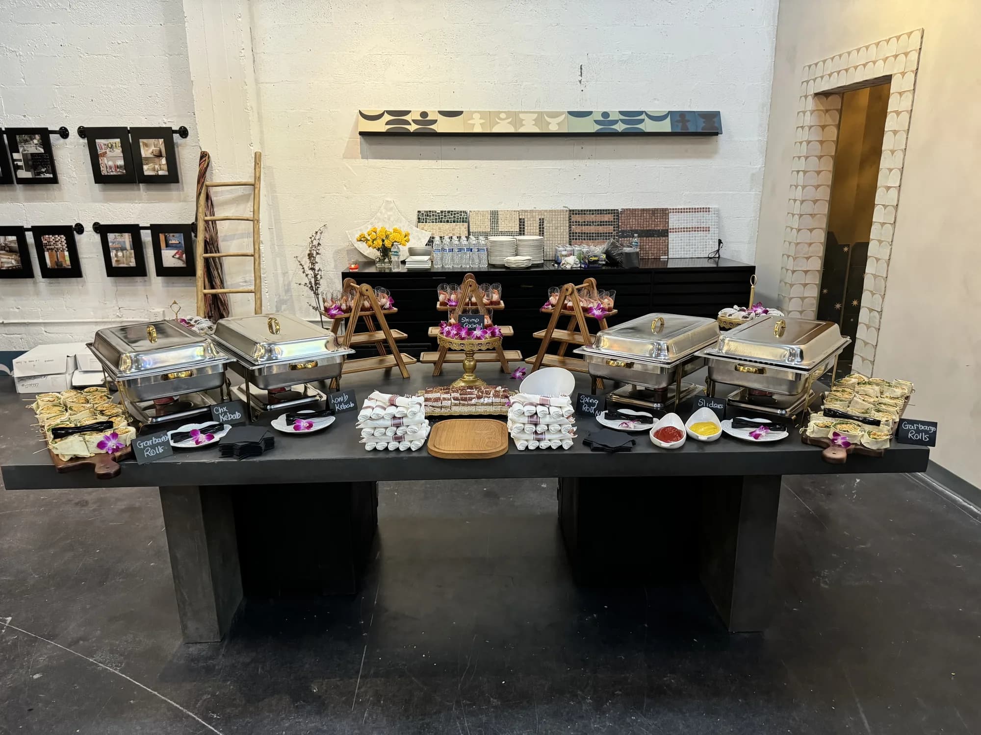 Catered buffet table set up in a restaurant-style space