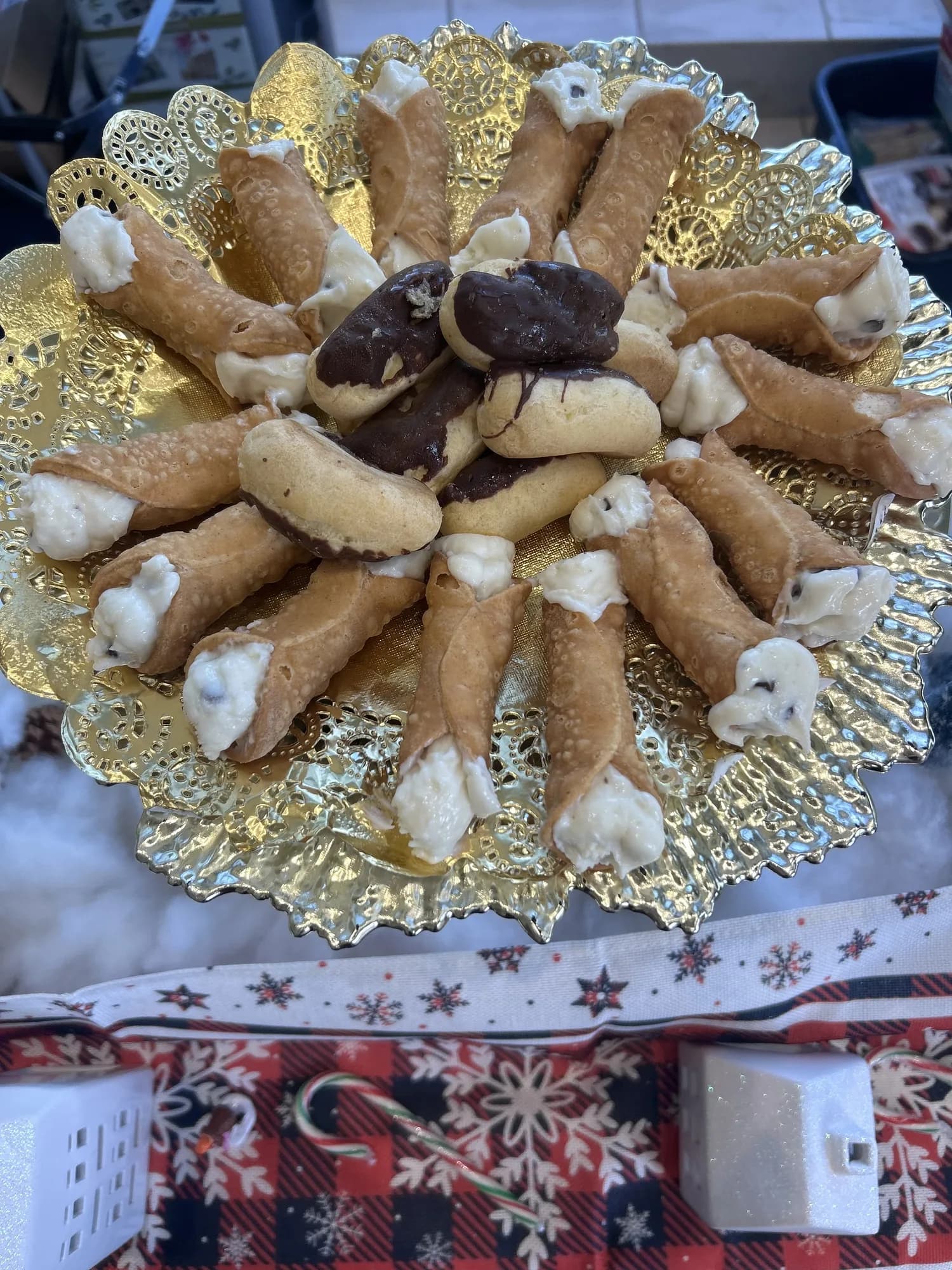 Cannoli platter with gold trim at a holiday event