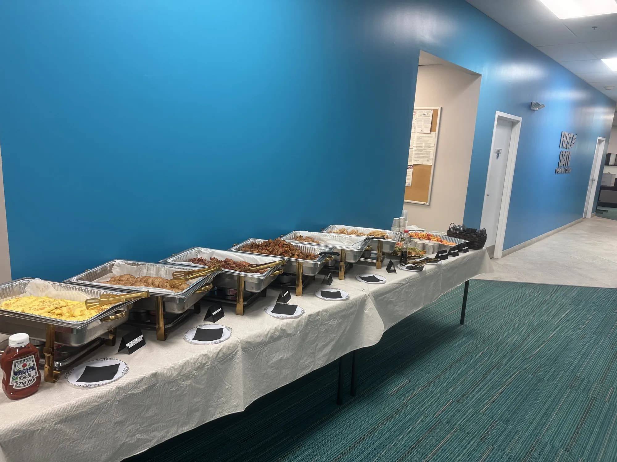 Corporate office buffet with hot entrées and sides