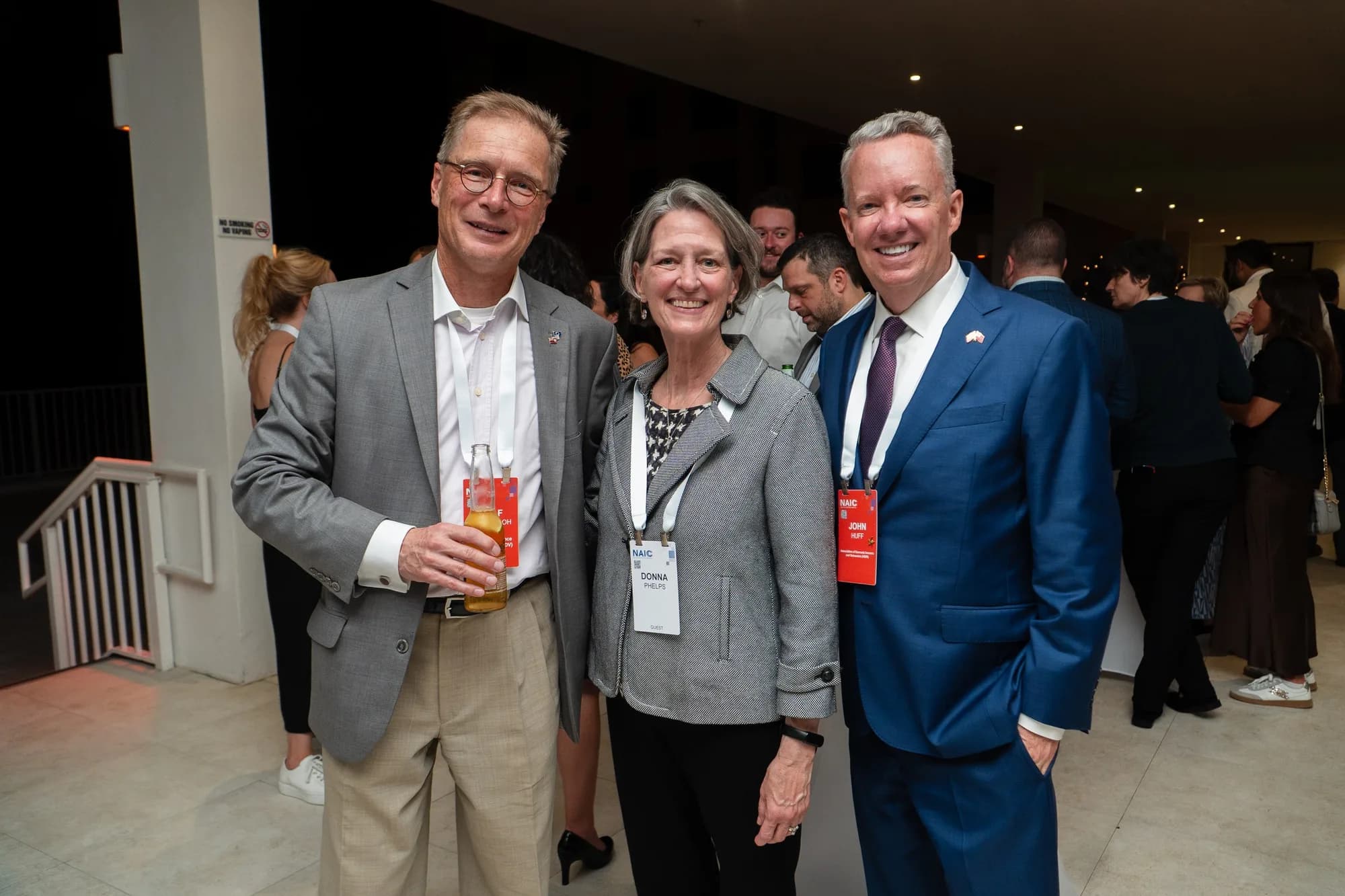 Attendees with name badges at a catered corporate reception