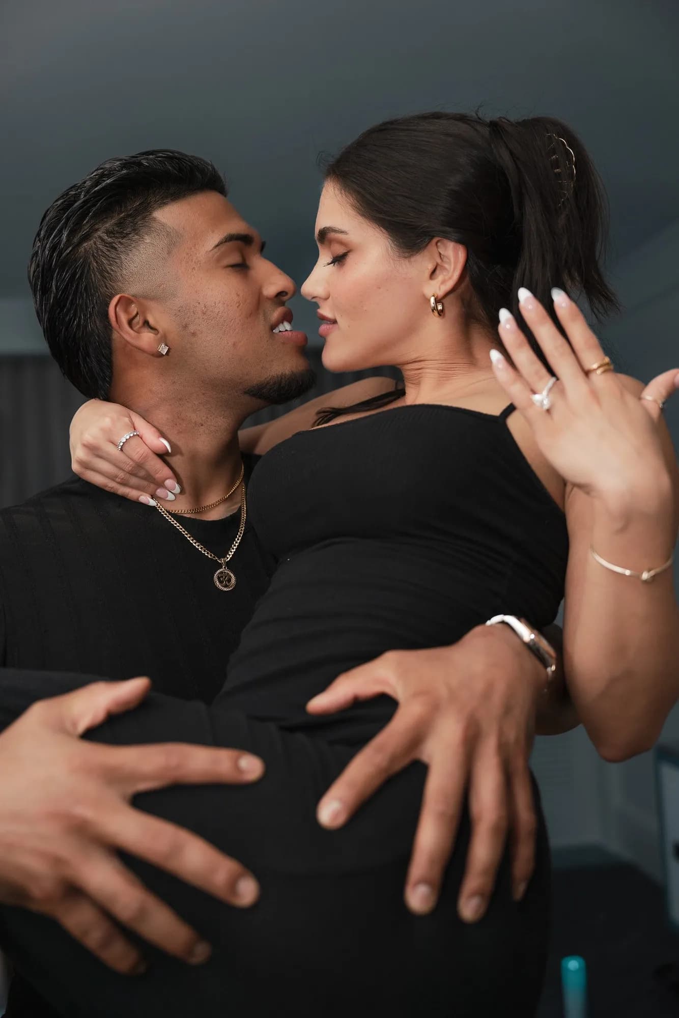 Couple showing the engagement ring
