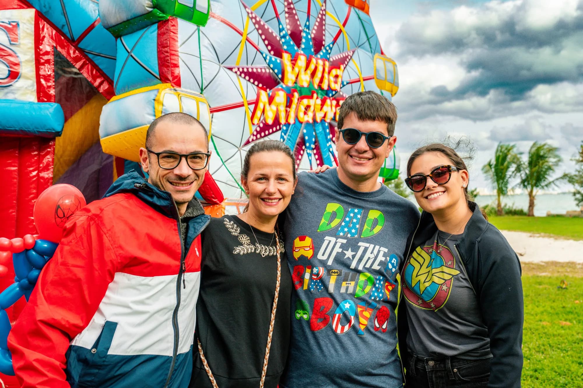 Family at an inflatable attraction at a birthday party
