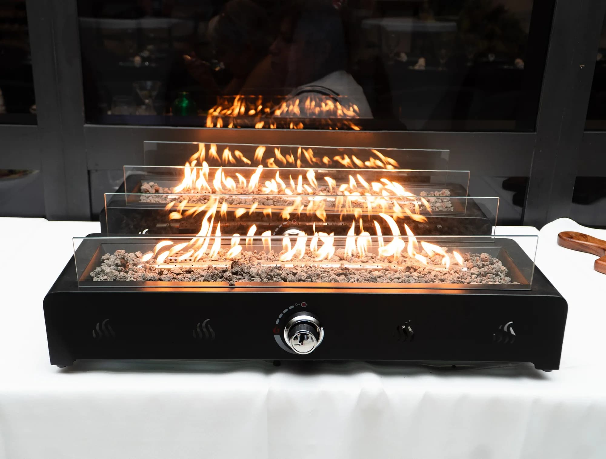 Fire pit feature at an evening corporate reception