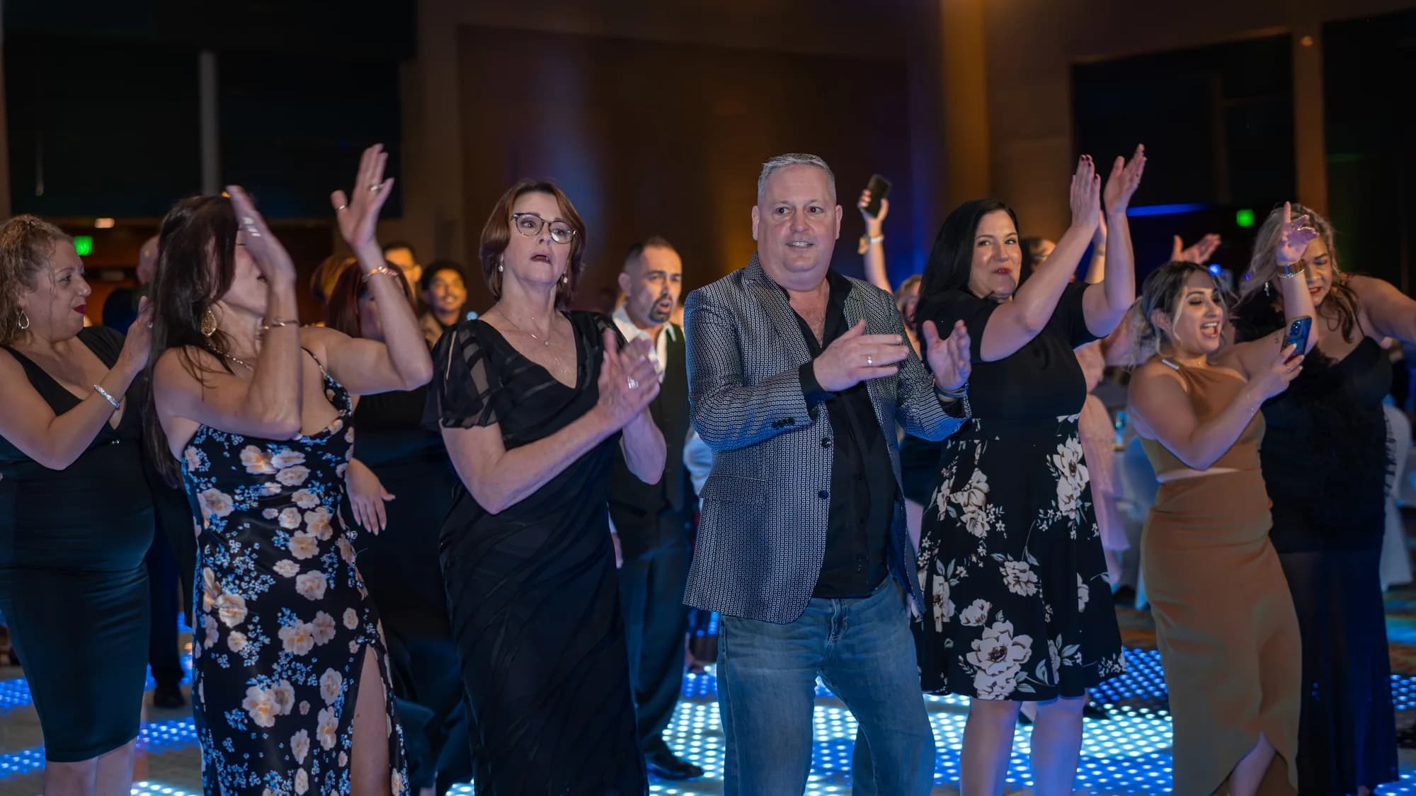 Crowd cheering at a corporate gala