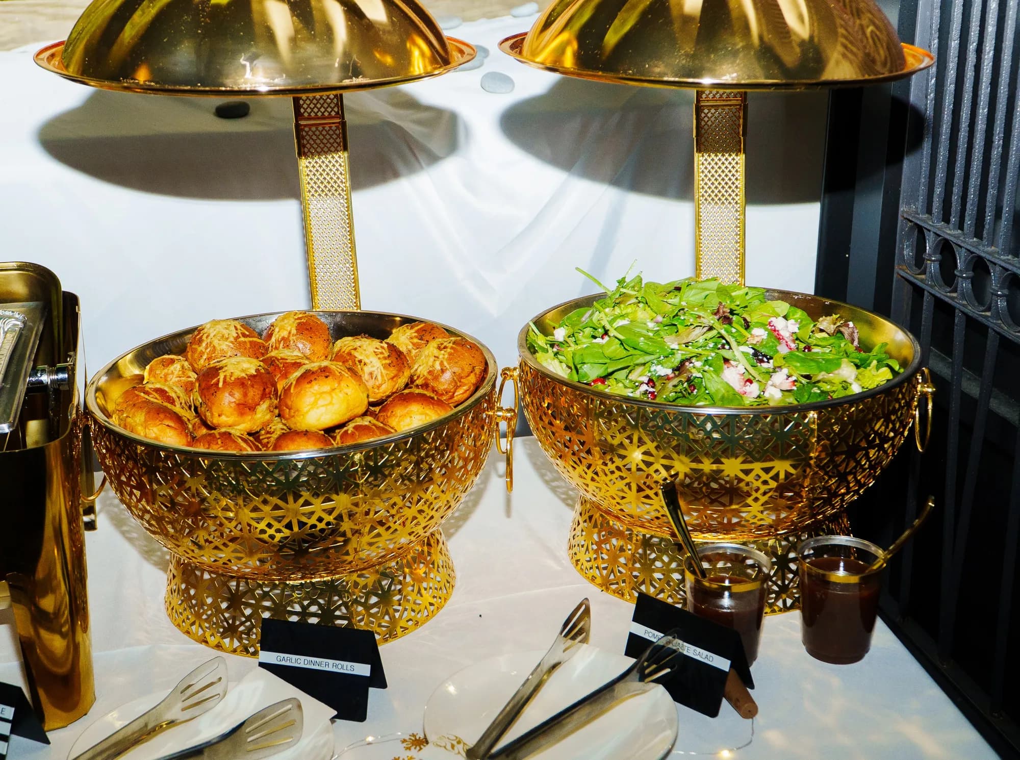 Gold chafing dishes with sides on a catered buffet