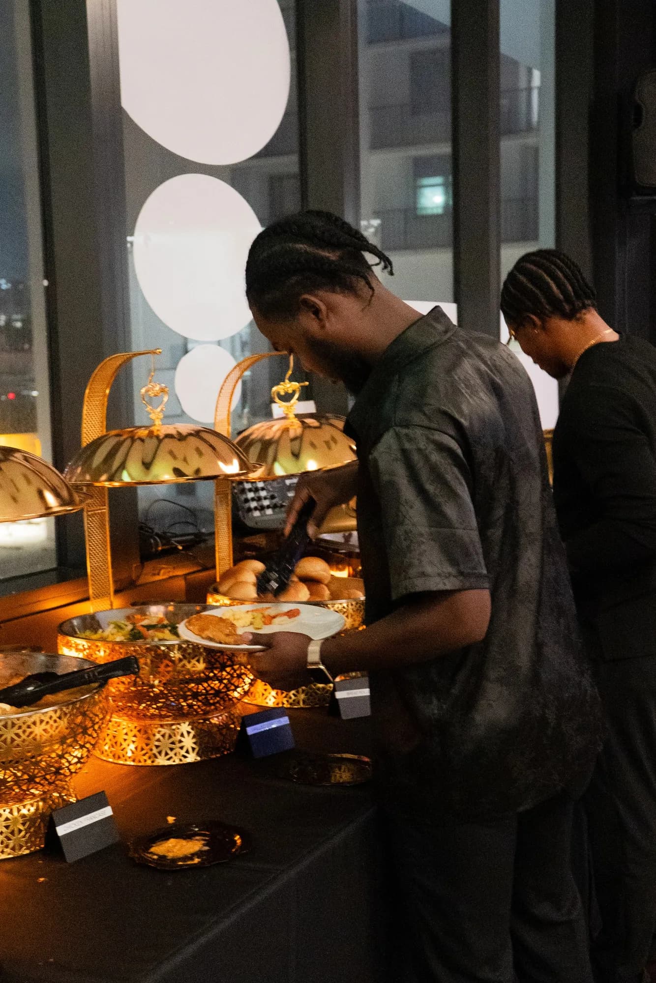Server at the buffet during a graduation party