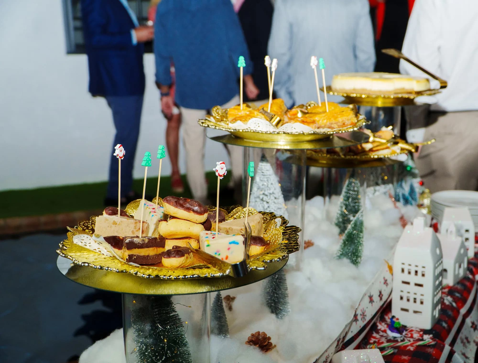 Gold appetizer platters at a holiday catered event