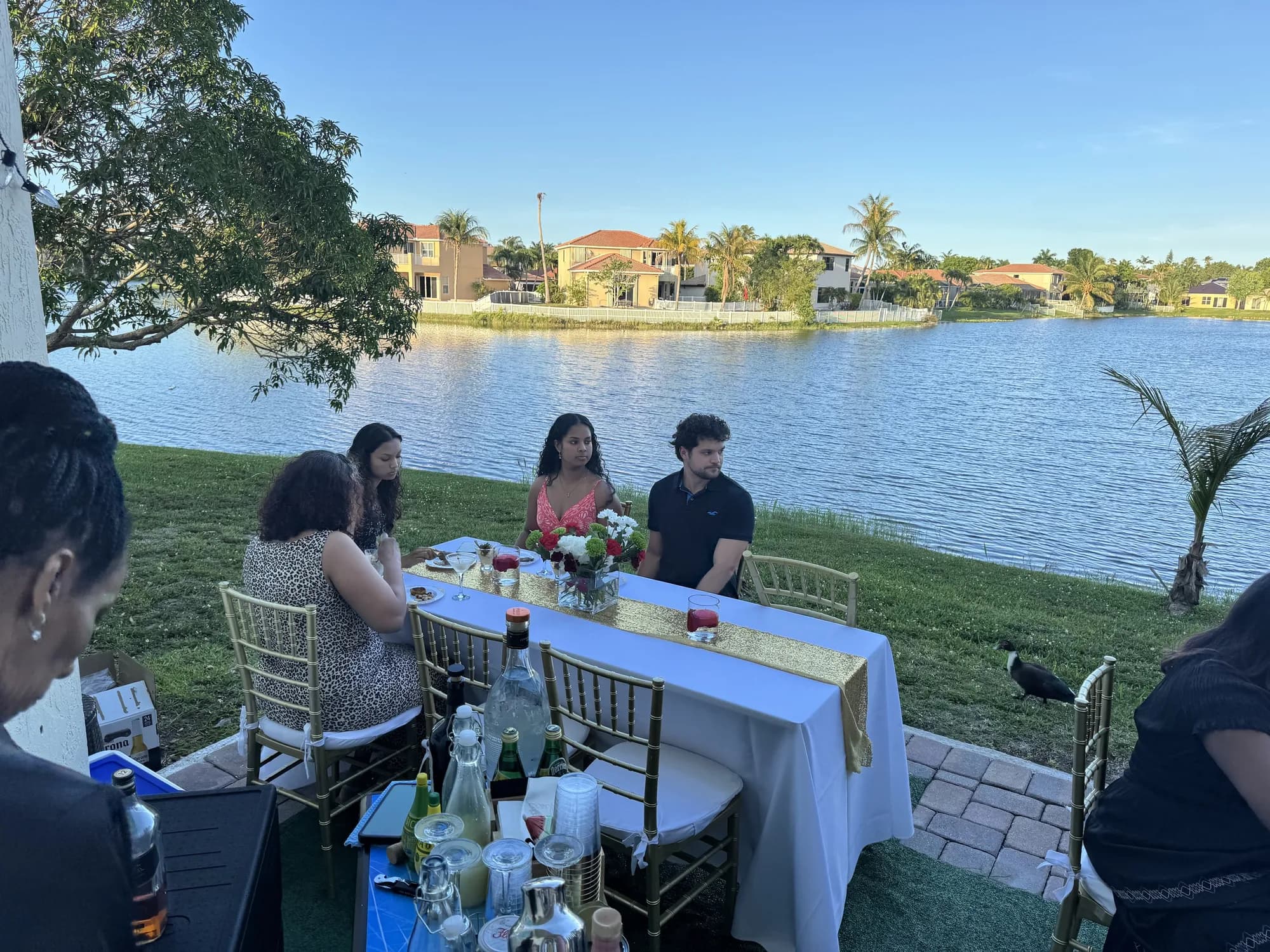 Lakeside backyard party with linen-draped tables