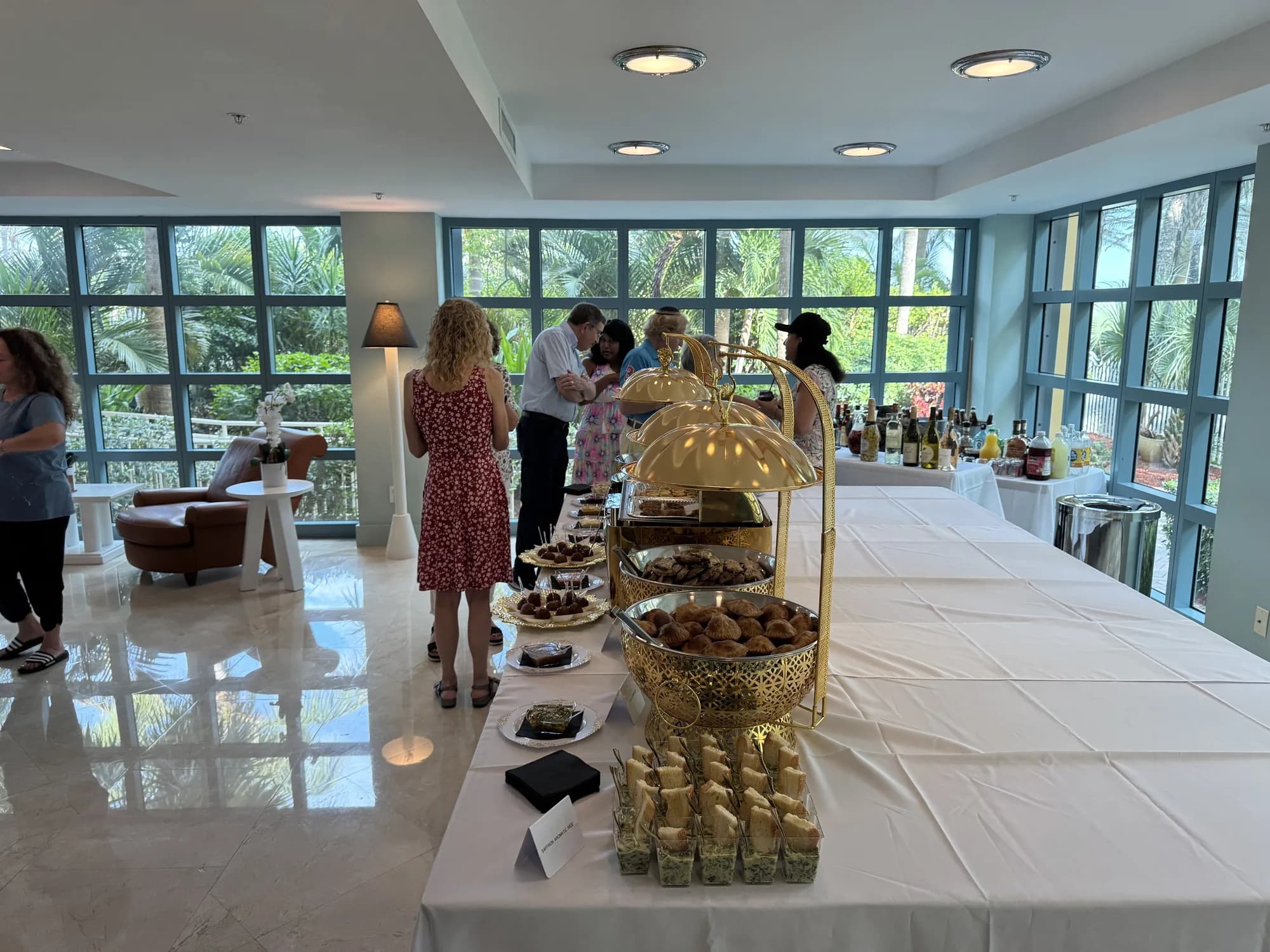 Appetizer station with gold cloches at a mixer