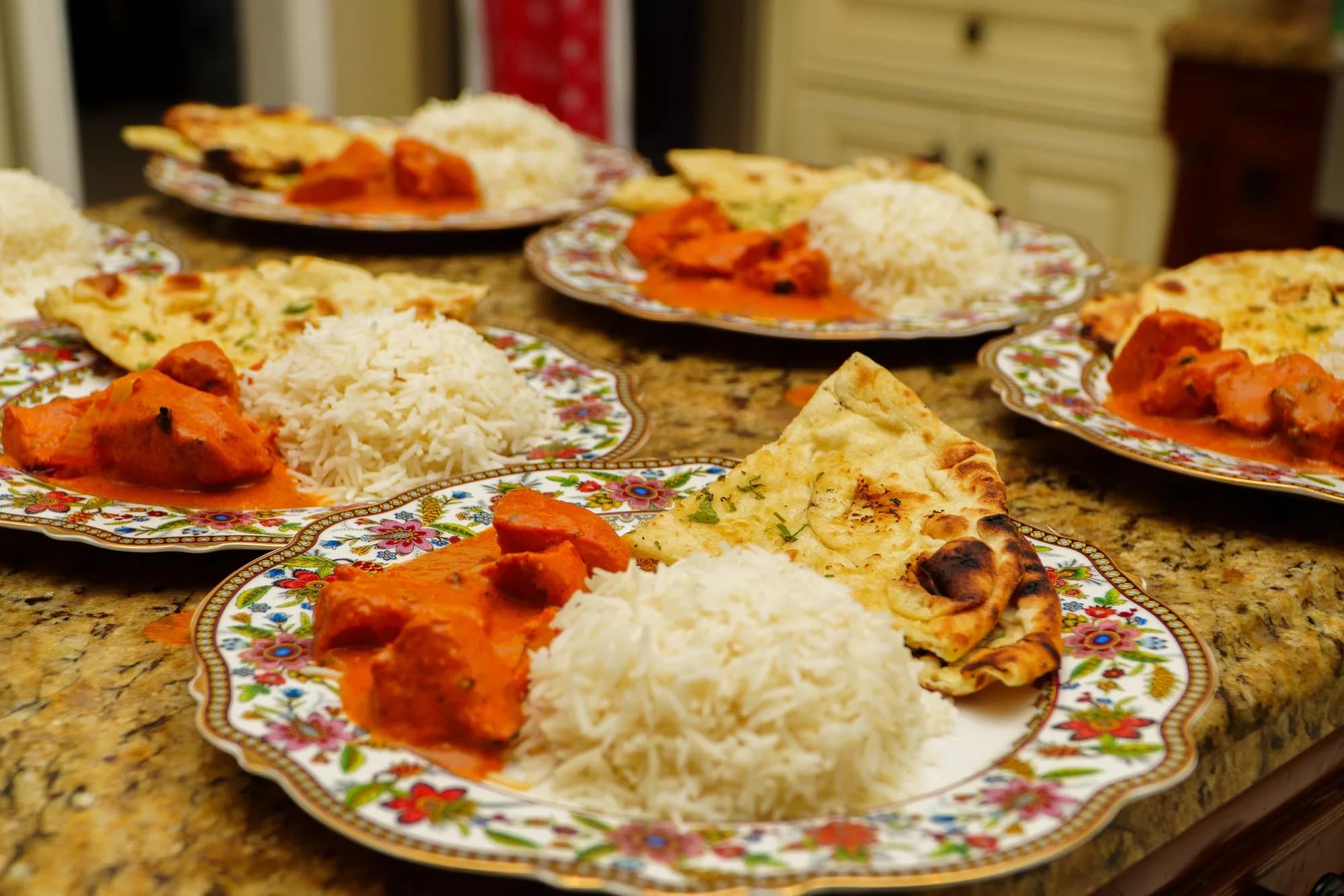 Plated chicken entrée with rice for a catered dinner service