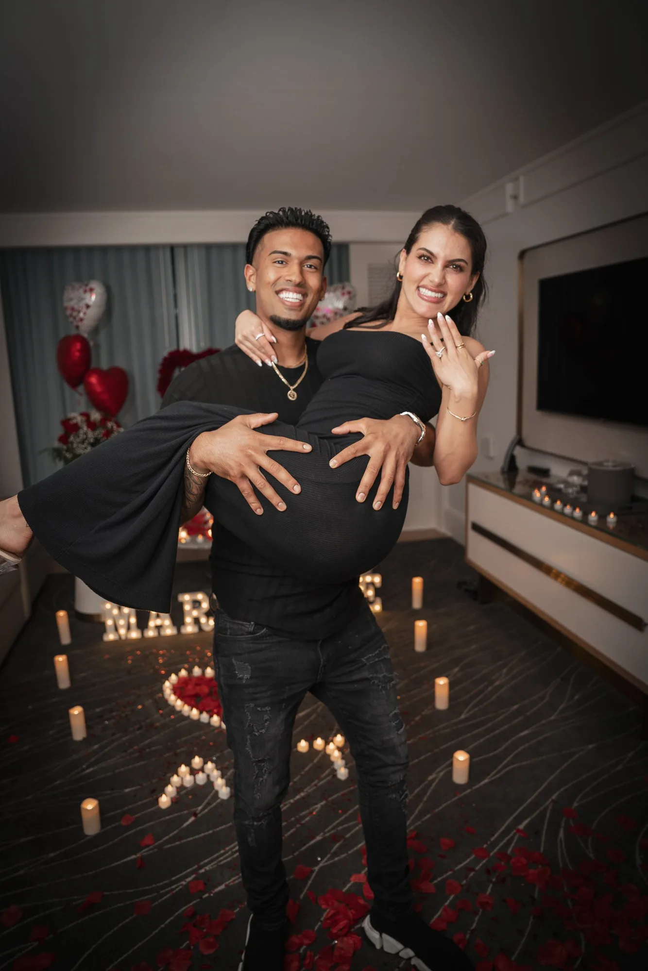 Proposal setup with candles and heart balloons