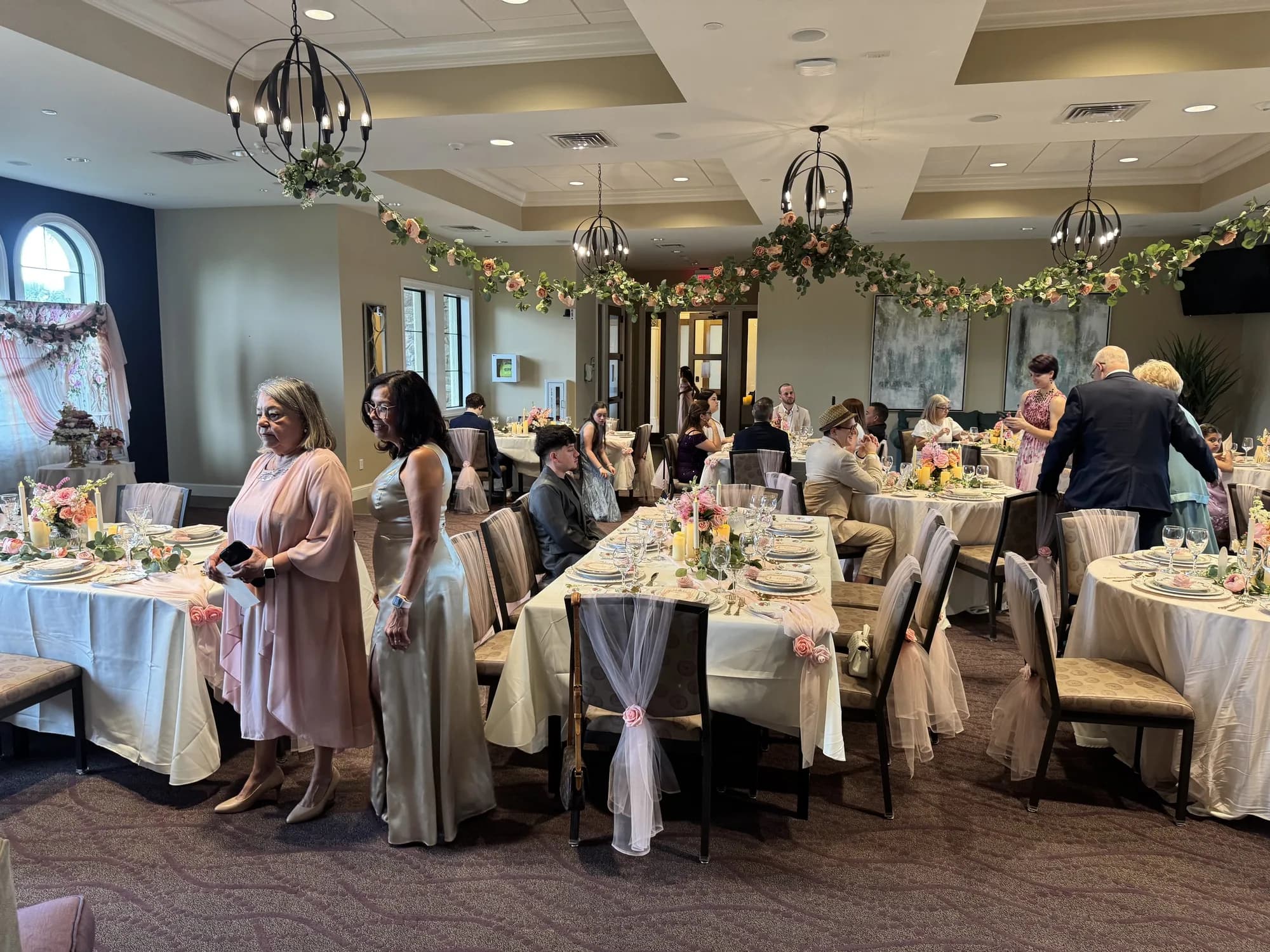 Guests at a pastel-decorated quinceañera