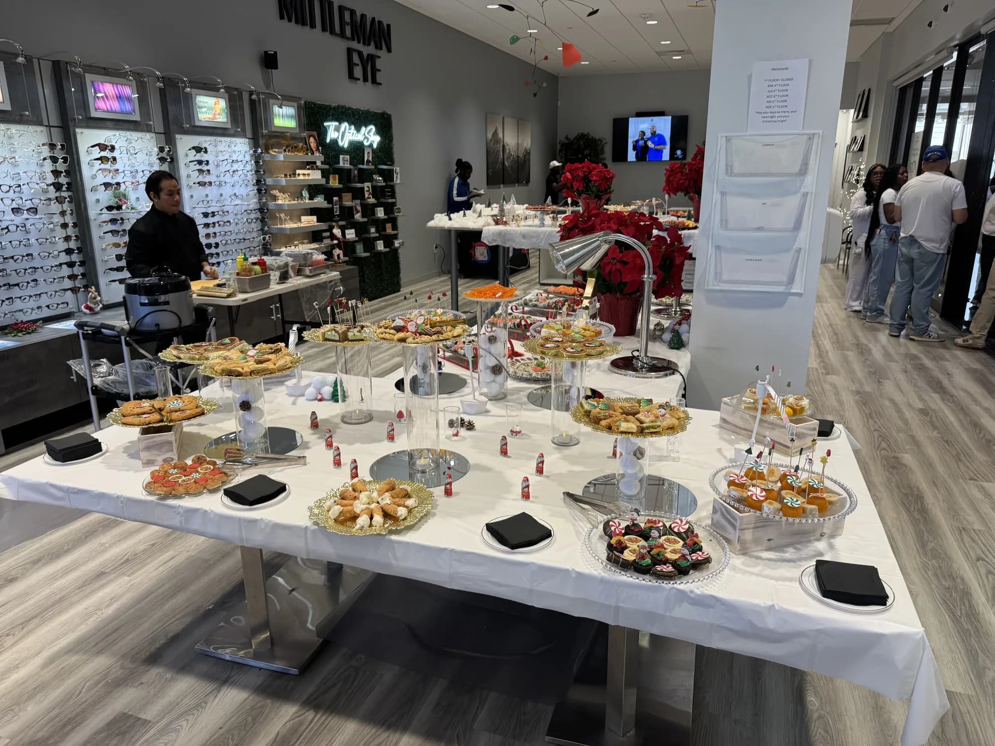 Buffet tables set up inside a showroom for a corporate event