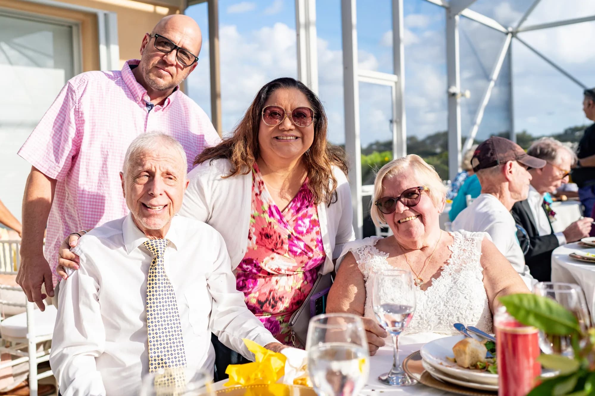 Wedding guests toasting at the reception