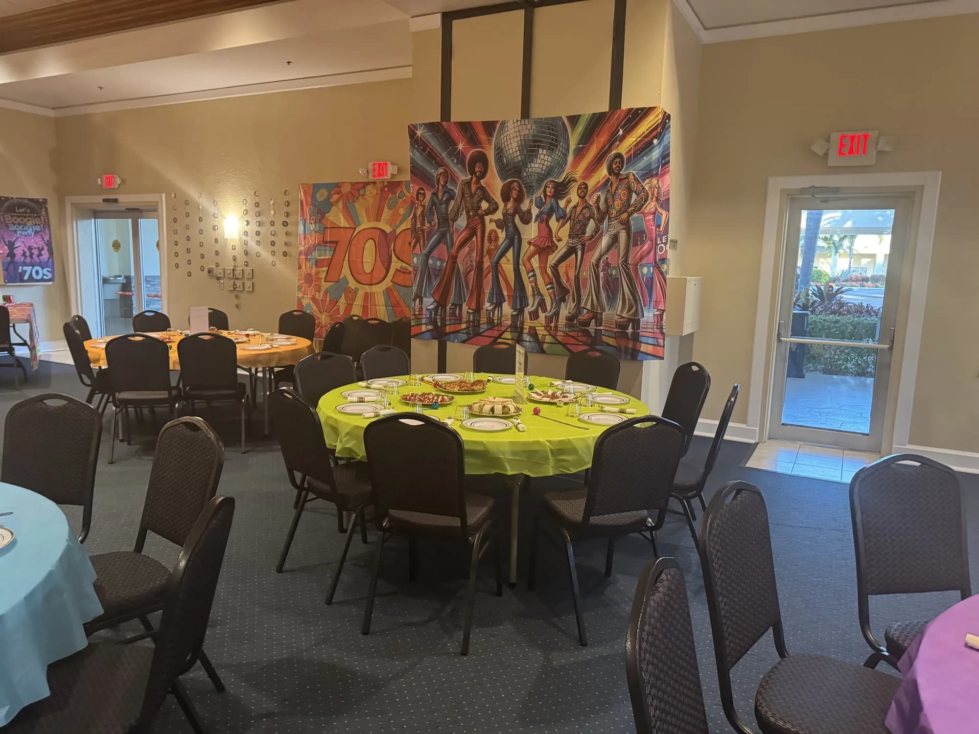 Yellow table setting in an art-filled event space